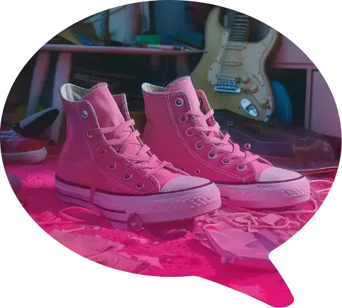 Un par de zapatillas altas rosas en el suelo de un dormitorio con una guitarra eléctrica detrás